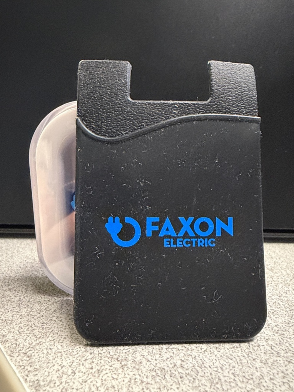 Electric Family Black Silicone Phone Card Holder with Blue Logo